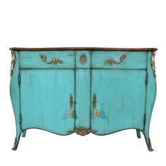 an old blue dresser with gold trimmings on the top and bottom, against a white background