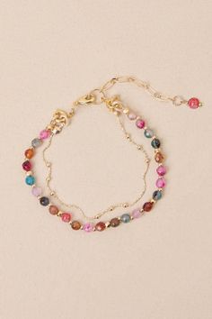 Styling your look with the Lulus Gorgeous Accent Gold Multi Beaded Layered Bracelet is always the right idea! Shiny, gold-toned metal shapes this dainty bracelet that has a layered design, with a slender length of chain paired with a multicolored strand of beads. Lobster clasp closure. 6" Long With A 1. 5" Extender Chain. 80% Agate, 20% Plated Brass. Imported. Lulus | Gorgeous Accent Gold Multi Beaded Layered Bracelet. Chain Bracelet Tutorial, Layered Bracelet, Layered Chain, Dainty Bracelet, Layered Design, Dainty Bracelets, Layered Bracelets, Bracelet Tutorial, Layers Design