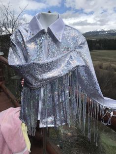 Girls silver/white high shine with   silver sequines fringe added to sleeve .  fringe can go over sleeve cap or underarm. this one has white collar but can be any color, choice of design on collar.   Hand wash, no heat lay flat to dry,   don't leave soak with the fringe all seams are surged  I can add fringe to all shirts for an extra 25$,  this one comes with it but can order just the shirt too.    I have several color of fringe, not all are sequines GIRLS  LARGE--MEASURMENTS BELOW      MEASURE Western Pleasure Shirt, Western Show Shirts, Fringe Shirt, Western Pleasure, Don't Leave, No Heat, Western Outfits, Girl Top, White Collar