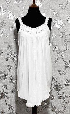 This gorgeous sleeveless Victorian nightgown is made entirely of cotton for the utmost in comfort and softness. It perfectly embodies the beauty and elegance of the Victorian era, embellished with exquisite lace accents. A hint of vintage charm can be added to your evening routine with this dreamy, timeless style created by the lightweight fabric and exquisite lace details. Summer Lace Trim Nightgown For Loungewear, Summer Nightgown With Lace Trim For Loungewear, Summer Cotton Nightgown For Loungewear, Feminine Summer Sleepwear For Relaxation, Summer Nightgown For Relaxation, White Lace Trim Sleepwear For Relaxation, Summer Nightgown With Spaghetti Straps And Lace Trim, Summer Cotton Nightgown For Sleep, Elegant Sleeveless Summer Sleepwear