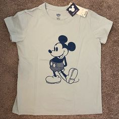 Brand New With Tags. Size M. Casual Blue Shirt With Cartoon Print, Blue Mickey Mouse Short Sleeve Tops, Casual Mickey Mouse Short Sleeve Tops, Blue Short Sleeve Tops With Mickey Mouse, Summer Cotton Mickey Mouse T-shirt, Summer Mickey Mouse Cotton T-shirt, Mickey Mouse Cotton T-shirt For Summer, Casual Mickey Mouse Cotton Tops, Blue Crew Neck Tops With Mickey Mouse Design