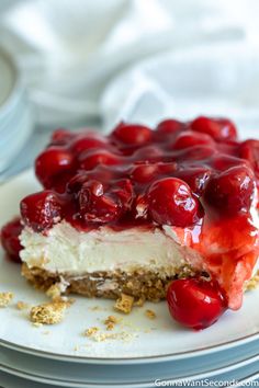 there is a piece of cheesecake with cherries on it and the words enjoy