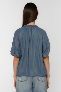 The Kenna Blouse offers an elegant style with its smocked neck, pleated elbow puff sleeve, and V-neck. It's perfect for dressier occasions, while still remaining comfortable and easy to wear. Material: 100% Tencel™ Eco-Friendly Color: 405 Malibu Machine wash cold or hand wash Model is 5'9" and wearing a size S Imported Summer Flutter Sleeve Top With Gathered Sleeves, Summer Tops With Gathered Flutter Sleeves, Spring V-neck Smocked Top With Gathered Sleeves, Spring Short Sleeve Smocked Top, Spring Smocked Top With Short Sleeves And Flowy Fit, Flowy Smocked Top With Short Sleeves For Spring, Casual Summer Blouse With Pleated Sleeves, Casual V-neck Peasant Top With Smocked Bodice, Spring Short Sleeve Blouse With Gathered Neckline