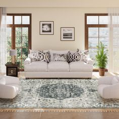 a living room filled with furniture and windows