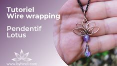 a hand holding a necklace with a butterfly on it and the words, how to wire wrapping