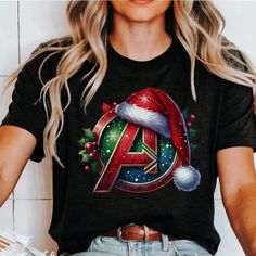 DESCRIPTION: Avengers Christmas shirt Design and Customization Details: This design is created using DTG (Direct to Garment) printing. If you would like to add or modify any aspect of the design shown in the display image, please contact the seller through the message box to confirm if the changes can be accommodated. If you place the order without prior confirmation, the item will be sent as shown, without any modifications. Refer to the color charts for the size and type of T-shirt you desire. Christmas Festive Shirt With Graphic Print, Festive Christmas Graphic Print Shirt, Avengers Christmas, Avengers Shirt, Types Of T Shirts, Christmas Custom, Message Box, Custom Shirt, Color Charts