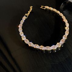 14K Gold Plated on Alloy Cubic zirconia stones Length: 167mm - 6.5" Weight: 9.5g Cubic Zirconia (Swarovski Element crystal) set in Lead-free, Eco-friend and hypoallergenic setting. This stunning bracelet is then Gold Plated to ensure a long-lasting and brilliant finish. Zircon Bracelet, Big Rings, Crystal Set, Polish Jewelry, Pearl Jewelry, Diamond Bracelet, Sterling Silver Jewelry, Diamond Necklace, Cubic Zirconia