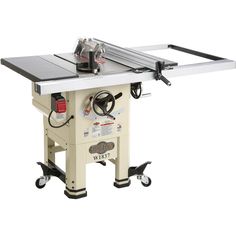 a table saw is sitting on top of a white stand with wheels and an extension handle