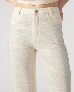 The JESSE jeans are the perfect embellished straight leg jeans, adorned with stunning rhinestones on the front. Elevate your style with this unique and eye-catching pant, perfect for making a statement. Embellished straight leg jeans Inseam: 30" 97% cotton, 3% spandex Hand wash Emma is 5ft 10in and is wearing a size small Imported Trendy Straight Leg Jeans With Rhinestones, Trendy Straight Leg Pants With Rhinestones, Party Jeans With Rhinestones Straight Leg, Party Straight Leg Jeans With Rhinestones, Trendy Straight Leg Flare Jeans With Rhinestones, Party Pants With Rhinestones And Straight Leg, Spring Sequin Straight Leg Jeans, Embellished Straight Leg Party Jeans, Party Embellished Straight Leg Jeans