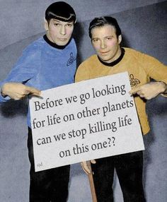 two men holding up a sign that says live long and prosper drink really 2x a day