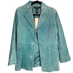 Nwt Dialogue Qvc Turquoise Blue 100% Hand Washable Suede Leather Button Up Jacket Size Xs Size: Xs Approximate Measurements (Laid Flat): * Pit To Pit: 19.5” * Length: 28” * Sleeve Length: 22.5” * Condition: New With Tags - Small Discoloration Spot On Bottom Front & Top Back (See Last 2 Photos) * Material: 100% Suede Leather Exterior, 100% Polyester Lining * Side Pockets * Fully Lined Including Inner Sleeves * Extra Buttons Included Please Let Me Know If You Have Any Questions About This Item. Sh Winter Washed Blue Outerwear With Button Closure, Washed Blue Outerwear With Button Closure, Washed Blue Button-up Outerwear, Teal Leather Jacket, Cheap Washed Blue Button-up Outerwear, Blue Suede Jacket, Leather Button Up, Turquoise Leather, Suede Jacket