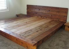 a bed made out of wooden planks in a room with carpeted flooring