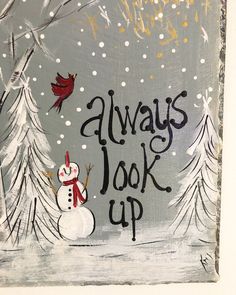 there is a painting on the wall that says always look up with a snowman