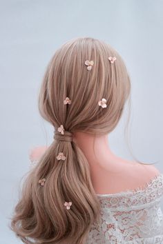 These delicate wedding flower hair pins are created for bride's airy hairstyle. This Little blush gold flowers will be a graceful addition to your dreamy romantic bridal look.  I handmade this flower hair pins, inspired by wild flowers. These precious handcrafted flowers are perfect to scatter across romantic ponytail and loose long braid as well. Bonus: This flower hair pins will goes well with any kind of hair styles. Yes, I'm not kidding you, any kind of hairstyles at any age and any occassions. >DETAILS of this small flower wedding hair pins: This is a set of 8pcs bride small flower hair pins Lenght: 3-5cm / 1-2 inches - This small flower bridal hair pins are designed and handmade in Indonesia - Available in blush gold - Handcrafted with handmade flowers from lacquer, with pearl beads Romantic Ponytail, Bride Flower Hair, Flower Hair Pins Wedding, Hair Pins Wedding, Hair Pins Bridal, Bride Flower, Flower Hair Pins, Floral Hair Pins, Delicate Wedding