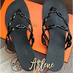 Hermes Island Sandal (Black) Size Eu 38, In Excellent Used Condition. Used Only Once For 2 Hours, Perfect For Summer, Beach & Resort Use. Luxury Black Leather Flip Flops, Designer Flat Flip Flops For Beach, Designer Black Flip Flops For The Beach, Designer Black Flip Flops For Beach, Elegant Black Flip Flops For Vacation, Designer Flip Flops For Beach, Luxury Open Toe Flip Flops For Beach, Designer Open Toe Flip Flops For Beach, Designer Black Flip Flops For Summer