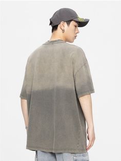 GTRG cotton short sleeve shirt, gradient effect and fading throughout, rib knit crewneck, dropped shoulders, text printed at front. Composition - 100% Cotton Asian Sizing: Size Up 1 Size For US/EU Fit Size Up 2 Sizes For US/EU Oversized Fit Model: 180cm/56kg 5’11/123lbs wearing size XL Gray Distressed Short Sleeve T-shirt, Trendy Faded T-shirt For Streetwear, Faded T-shirt For Summer Streetwear, Urban Style Washed Black Summer Tops, Faded Oversized Crew Neck Top, Oversized Faded Crew Neck Top, Spring Streetwear Faded Tops, Urban Style Faded Distressed T-shirt, Gray Short Sleeve Distressed T-shirt