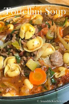 a large pot filled with pasta and vegetables