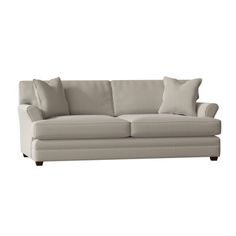 an image of a couch with pillows on it's back and the seat upholstered