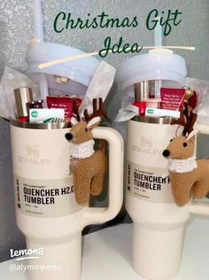 two coffee mugs with reindeer decorations on them and the words, christmas gift idea