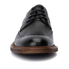 Elevate your debonair look with instant sophistication this season. The Clark oxford by Vintage Foundry Co. features exquisite wingtip and brogue detailing, making it a standout choice for any outfit. Whether paired with dark jeans for a smart-casual ensemble or with suit pants for a polished formal look, these oxfords offer versatility and style. Step out with confidence and refine your wardrobe with the Clark oxford, where classic elegance meets modern design. Masculine Wingtip Lace-up Business Shoes, Textured Sole Wingtip Oxfords, Black Wingtip Lace-up Shoes For Formal Occasions, Black Wingtip Dress Shoes With Rubber Sole, Black Business Oxfords With Textured Sole, Black Dress Shoes With Textured Sole For Business Casual, Business Wingtip Oxfords With Goodyear Welt, Black Wingtip Dress Shoes With Leather Sole, Black Brogue Lace-up Shoes For Derby