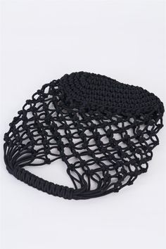 two black crocheted bags sitting on top of each other