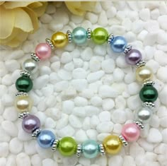 Pink, Blue, Green, Yellow, Purple, White And Silver Beaded Stretch Bracelet. Stretch Bracelets Diy, Stretch Beaded Bracelets Diy, Diy Jewelry Rings, Homemade Bracelets, Fun Bracelet, Kids Bracelets, Beads Bracelet Design, Bracelet Diy, Beaded Bracelets Diy