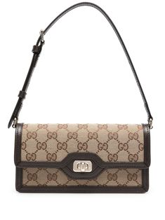 Gg motif mini bag by Gucci. This item is in size UNI and the color is Beige Monogram Canvas Shoulder Baguette Bag, Designer Brown Monogram Canvas Baguette Bag, Luxury Brown Monogram Canvas Baguette Bag, Elegant Brown Monogram Canvas Baguette Bag, Designer Brown Pouch Baguette Bag, Brown Monogram Canvas Baguette Bag, Designer Brown Baguette Bag In Pouch Shape, Classic Monogram Canvas Clutch Bag, Elegant Monogram Canvas Baguette Bag For Everyday Use