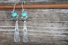 Turquoise Silver Earrings Dangle Earrings Drop Earrings Boho Earrings Jewelry Kokopelli Earrings Southwest Gift for Women Gift For Wife Color/Description : Antique silver Kokopelli drop pendant and turquoise blue rondelles beads. Size : 2inches including the sterling silver lever back Ear wires : sterling silver lever back Silver Earrings : https://www.etsy.com/shop/NtikArtJewelry?ref=seller-platform-mcnav&section_id=16071165 To return to my shop : https://www.etsy.com/shop/NtikArtJewelry Th Earrings Western, Western Earrings, Christmas Gifts For Wife, Hammered Sterling Silver, Earrings Drop, Earrings Boho, Gift For Wife, Silver Earrings Dangle, Drop Pendant