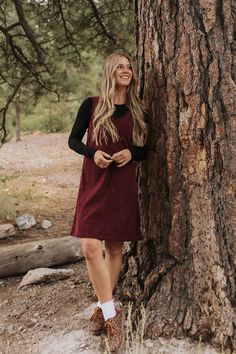 Get ready for fall with THE BLAKE OVERALL DRESS by Pink Desert! In cozy burgundy corduroy, this v-neck dress with thick straps is perfect for layering and exudes fall vibes. Made for comfort and modest style, this overall dress is a must-have for your autumn wardrobe. Bring on the cooler weather! Paired with THE WIMBLEDON LONG SLEEVE TOP IN WHITE , THE WIMBLEDON LONG SLEEVE TOP IN BLACK AND WHITE STRIPES , THE FLORANCE FLORAL MESH LAYERING LONG SLEEVE IN BEIGE , THE LACE UP SNEAKERS IN LEOPARD & Courdory Dress Outfits, Courdory Dress Outfit, Dress With Thick Straps, Mesh Layering, Dress Overalls, Cold Weather Dresses, Cozy Fall Vibes, Preppy Fall Outfits, Jean Dresses