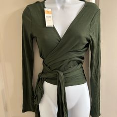 New Green Wrap Blouse. Has Very Long Wrap Around Sashes To Wear In Many Different Styles Chic Green Tops With Tie Waist, Fall Wrap Top For Brunch, Fall Season Wrap Top For Brunch, Fall Brunch Wrap Top, Chic Green Wrap Top For Spring, Wrap Top With Tie Waist For Brunch, Green Wrap Top For Spring, Fall Season Tie Waist Wrap Blouse, Fall Wrap Blouse With Tie Waist