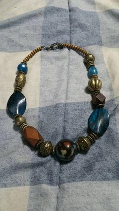 Earth Toned Colors Brown and Turquoise Blue Plastic and Wood Beads 18 inch Necklace Costume Jewelry Fashion Accessory This is a nice find and very functional. Priced to sell. Check out our shop for monthly specials. We have a variety of items for every taste. Combine several of our items together to save on shipping. If you have any questions please do not hesitate to ask. I will ship outside of the US, just request a quote. Happy Shopping. I will work around the priority mail price. Just send m Blue Wooden Beads Round Jewelry, Blue Wooden Round Beads Jewelry, Blue Wooden Beaded Round Jewelry, Blue Wooden Beads For Jewelry Making, Blue Costume Jewelry Necklace With Large Beads, Blue Wooden Beads Jewelry For Jewelry Making, Vintage Blue Necklaces With Colorful Beads, Blue Bohemian Wooden Beads Necklaces, Blue Metal Beads For Jewelry Making