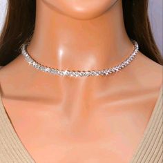 Silver Rhinestone Diamond Choker Necklace Make An Offer Or Bundle For Huge Discount Diamond White Rhinestone Necklace, Dazzling Diamond White Sparkling Rhinestone Necklace, Diamond White Rhinestone Necklace For Party, Diamond White Sparkling Rhinestone Necklace For Party, Dazzling Sparkling Rhinestone Necklace, Dazzling Crystal Necklaces With Rhinestones, Party Bling Rhinestone Necklace In Diamond White, Glamorous Sparkling Rhinestone Necklace With Cubic Zirconia, Party Crystal Necklaces With Sparkling Diamonds