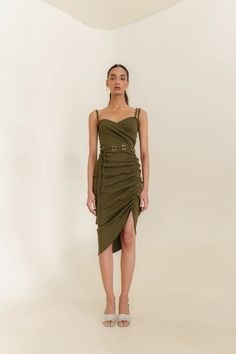 Indulge in luxury with the Daniela Dress, featuring a delicate braided buckle belt with a glamorous metallic gold buckle a sweetheart neckline. The asymmetrical design and drawstring detail add a touch of sophistication and the perfect fit for any party or special event. Elevate your style with this exclusive piece. The model is wearing size S. 🌸 〰️〰️〰️ 🌸 〰️〰️〰️ 🌸 Care and Composition100% Cotton Rib Dry clean/Hand wash in cold water. Mild liquid detergent only. Do not soak or wring. Designed & Made in India. Chic Midi Dress With Belt For Party, Dressy Belted Midi Dress For Party, Elegant Belted Mini Dress For Summer, Elegant Mini Dress With Strap Detailing, Elegant Summer Midi Dress With Ruched Sides, Chic Belted Midi Dress For Party, Chic Midi Mini Dress With Ruched Sides, Elegant Party Midi Dress With Belt, Spring Party Midi Dress With Belt