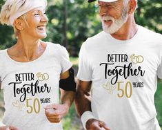 an older couple wearing matching t - shirts with the words better together and 50 years on them