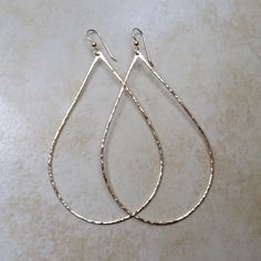 "Gold Teardrop Hoop Earrings~ Beautiful handmade hammered teardrop hoop earrings, polished to a beautiful shine for an elegant look! Choose from sizes ~ SMALL approx. 1\" MEDIUM approx. 1.5\" LARGE approx. 2\" width of the hoop * model is wearing approx. 1.5\" width hoops. Made with 14k gold fill 16 gauge wire Also available in sterling silver ~ https://www.etsy.com/listing/119110728/teardrop-hoops-sterling-silver-hoop SHOP~ http://www.etsy.com/shop/HanaMauiCreations?ref=si_shop International bu Hammered Teardrop Earrings For Anniversary, Teardrop Hoop Earrings For Wedding, Elegant Teardrop Hammered Hoop Earrings, Hammered Teardrop Earrings, Metal Teardrop Earrings For Wedding, Adjustable Teardrop Hoop Earrings For Wedding, Hammered Hoop Earrings For Wedding, Hammered Hoop Jewelry For Wedding, Hammered Hoop Wedding Jewelry