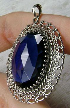 "Simulated Blue Sapphire Pendant Mesh Design#P14 Custom Made Inspired by Victorian era jewelry, I now offer this lovely Antique reproduction in sterling silver. The 20ct simulated blue sapphire gemstone is 24mm long (just shy of 1 inch) and 18mm in width (11/16th\"). The entire pendant is 1 3/4th inches long. The necklace/bail opening is 5mm x 3mm. Notice the beautiful craftsmanship of the Victorian filigree setting. The original antique piece that this pendant was designed from, was a Victorian Fine Jewelry Silver Sapphire Jewelry, Sterling Silver Oval Pendant For Formal Occasions, Sterling Silver Oval Pendant Jewelry For Formal Occasions, Exquisite Silver Sapphire Jewelry, Exquisite Sapphire Round Jewelry, Victorian Sapphire Jewelry With Filigree, Victorian Silver Jewelry With Diamond Cut, Sapphire Pendant With Diamond Cut, Victorian Silver Diamond Cut Jewelry