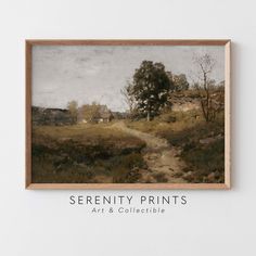 the serenty prints art and collectible logo is displayed in front of a white wall