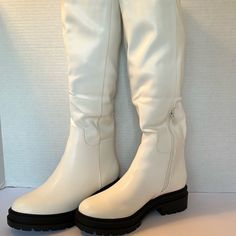 Size 5 1/2. White. White Synthetic Boots With Flat Heel, White Synthetic Flat Heel Boots, White Synthetic Boots With Almond Toe, White Wide Calf Boots With Round Toe, White Synthetic Almond Toe Boots, White Almond Toe Synthetic Boots, White Knee-high Synthetic Boots, Casual White Wide Calf Boots, High Platform Boots