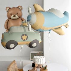 some balloons that are shaped like cars and bears