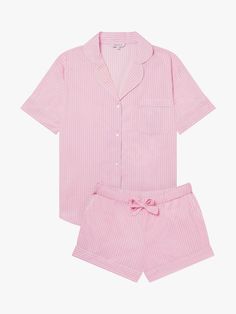 Designed to feel both classic and contemporary, and cut for a relaxed fit, this 100% organic GOTS certified cotton pyjama short set will brighten your nights and mornings with its vibrant all-over print. With piped trims throughout, the shorts come with handy slip pockets at sides and a drawstring elasticated waistband with fabric self-tie.  If you like your pjs cut a little more generously we recommend going up a size.  Organic cotton is grown without the use of chemicals such as fertilisers and pesticides, helping to support healthier and more sustainable farming practices. Short Pjs Pyjama Sets, Pink Pj Set, Cute Pink Pjs, Pyjama Sets, Pink Pjs, Cotton Pjs, Pink Pajamas