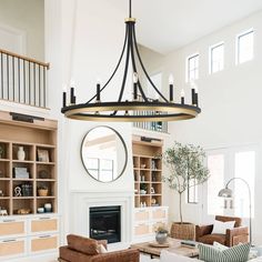 Inspired by crown, this large wagon wheel chandelier is sure to add a touch of mid-century elegance to your home. Crafted with attention to detail, this statement piece features different stunning finishes that complement any decor. Light Living Room, Wooden Wagon, Wheel Chandelier, Empire Chandelier, Wagon Wheel Chandelier, Farmhouse Chandelier, Sukabumi, Light Crafts, Bathroom Outdoor