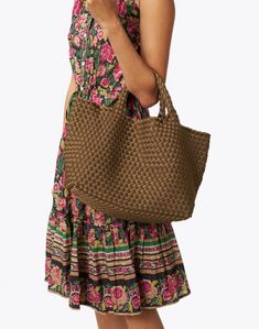 Embrace Naghedi's laid-back elegance with the best-selling St. Barths tote bag. It's expertly woven from neoprene and features a matching pouch that's perfect for toting your everyday essentials.