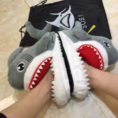 CUTE SHARK DESIGN: Decorated with a Shark, this pair of slippers looks really cute. You'll feel happy when seeing the adorable slippers when coming back home. A day's tiredness will be reduced soon. COMFORTABLE AND SOFT: The slippers are made with high quality 1”thick foam footbeds, soft polyester plush, and terrycloth details. Soft plush slipper will keep your toes warm. This style of slipper is anti-slip designed, you do not need to worry about slipping in the living room. Solid high density m Shark Funny, Wide Set Eyes, Cool Sharks, Fun Slippers, Funny Shoes, Cartoon Shark, Shark Slippers, Large Size Womens Shoes, Shark Plush