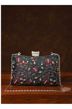 This is one of a kind handcrafted bag which is handcrafted to order. As it is a handcrafted product, it may have slight irregularities or imperfections.  MEASUREMENTS Length - 15.24cm Width - 19.30cm Handle - 58.42cm This clutch can be worn as a crossbody bag or a shoulder bag with the sling chain or can simply be carried in hand. It is spacious enough to carry mobile phones, cosmetics, keys and other small accessories. It's a beautiful ornamented piece to carry to weddings, parties and other fo Silk Clutch, Silk Gifts, Embroidered Clutch, Handcrafted Bags, Evening Clutch, Small Accessories, Embroidered Silk, Handbag Purse, Clutch Handbag