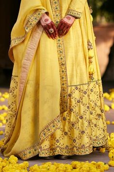 Yellow flared raw silk lehenga with buttercup bloom jaal zardozi embroidery on the border. Paired with a full sleeves raw silk padded blouse with floral zardozi embroidery on the sleeves, neckline and organza dupatta adorned with floral hand embroidered zardozi border. - Aza Fashions Slub Silk Wedding Sets With Dori Work, Slub Silk Sets With Dori Work For Wedding, Yellow Silk Palazzo Set For Wedding, Wedding Traditional Wear With Dori Work In Slub Silk, Slub Silk Traditional Wear With Dori Work For Wedding, Wedding Slub Silk Traditional Wear With Dori Work, Designer Slub Silk Lehenga With Dori Work, Designer Slub Silk Lehenga With Gota Work, Wedding Slub Silk Lehenga For Navratri