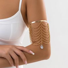 Looking for a trendy and stylish accessory to add to your jewelry collection? Look no further than our Waterdrop Arm Cuff Bangles for Women! Crafted from high-quality materials, these stunning arm cuffs feature a unique and eye-catching design inspired by the beauty of nature. The waterdrop shape adds a touch of elegance and sophistication to any outfit, making these bangles the perfect statement piece to elevate your look. Available in a variety of different colors and finishes, these arm cuffs Upper Arm Bracelet, Arm Cuff Bracelet, Arm Bracelets Upper, Arm Bracelet, Thigh Chain, Makeup Accesories, Trend Jewelry, Arm Cuffs, Trending Bracelets