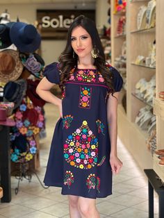 This Beautiful Floral embroidered Dress is the perfect dress to add to your wardrobe.  -Its cute enough to dress up for a party or even just wear it to a picnic.  -It's lightweight, handmade and hand embroidered by Mexican Artisans in Puebla, Mexico. More dresses available here: https://www.etsy.com/es/shop/SoleiEthnic?ref=seller-platform-mcnav&section_id=25367133 Hand Embroidered Gifts, Hand Embroidered Dress, Traditional Mexican Dress, Frida Kahlo Style, Dress Traditional, Mexican Dress, Floral Babydoll Dress, Dress Bohemian, Traditional Mexican