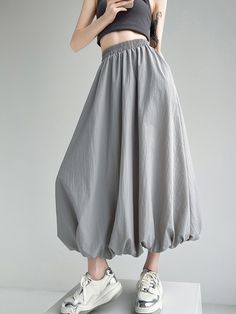 This flowy A-line skirt combines comfort and style with its elasticity and pleated pockets, all in a solid color design. Perfect for versatile styling, it effortlessly transitions from casual to semi-formal occasions. Dots Clothing, Polka Dots Outfit, Fuchsia Dress, Asymmetrical Blouse, Leisure Fashion, Iconic Dresses, Sweater Trends, Beige Dresses, Long Sleeve Short Dress