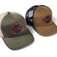 Get nostalgic with our Vintage Style Toyota Laser Engraved Leatherette Patch Trucker Hat! Classic design meets modern flair. Elevate your style with comfort. Embrace the road ahead in timeless fashion. Color: Green camo front and visor. Green perforated fabric back. Brown Retro Hat For Outdoor, Retro Leather Cap, Retro Brown Baseball Cap For Outdoor, Vintage Outdoor Hat With Leather Patch, Classic Brown Trucker Hat, Classic Adjustable Brown Trucker Hat, Classic Brown Adjustable Trucker Hat, Brown Trucker Hat With Flat Brim, Vintage Cap With Leather Patch