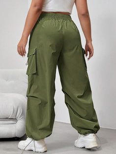 Embrace the utility trend with our Flap Side Pocket Drawstring Waist Loose Cargo Pants. These long-length pants combine practicality and style effortlessly. The loose fit and natural waistline provide all-day comfort, while the button details and flap side pockets add a touch of rugged charm. Made from durable woven fabric, these cargo pants are built to withstand daily wear and tear. Specifications: Details: Button, Pocket Waist Line: Natural Fit Type: Loose Type: Cargo Pants Length: Long Fabri Baggy Utility Harem Pants With Elastic Waistband, Green Wide Leg Cargo Pants With Drawstring, Wide Leg Parachute Pants With Drawstring For Outdoor, Baggy Green Bottoms With Drawstring, Baggy Drawstring Cargo Pants For Outdoor Activities, Baggy Cargo Pants With Drawstring For Outdoor Activities, High Waist Utility Parachute Pants For Outdoor, Wide Leg Bottoms For Spring Outdoor Activities, High-waist Utility Parachute Pants For Outdoor